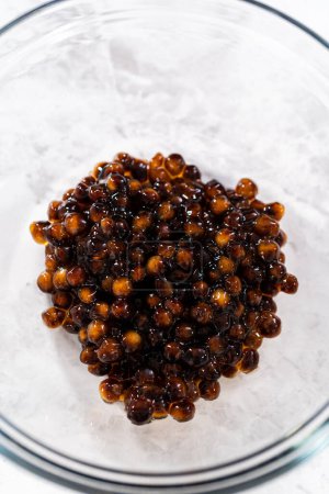 Photo for Preparing boba pearls for mango boba smoothie. - Royalty Free Image