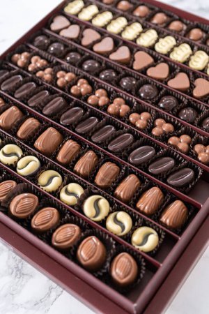 Photo for Box of gourmet assorted chocolates ina large box. - Royalty Free Image