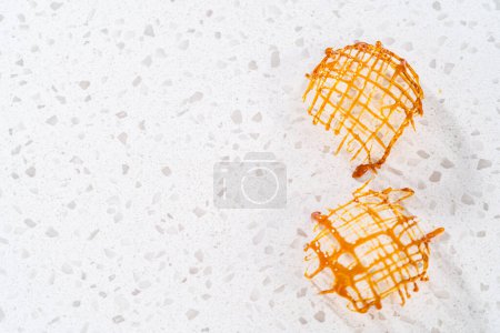 Photo for Crunchy caramel cupcake toppers on the counter. - Royalty Free Image