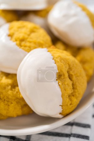 Photo for Lemon Cookies with White Chocolate. Freshly baked lemon cookies with white chocolate on a white ceramic plate. - Royalty Free Image