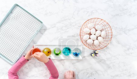 Photo for Flat lay. Easter egg coloring. Mixing food coloring with water and a dash of white vinegar to dye Easter eggs. - Royalty Free Image