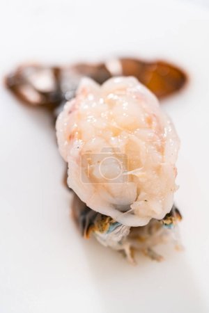 Photo for Preparing raw lobster tails to make garlic lobster tails. - Royalty Free Image