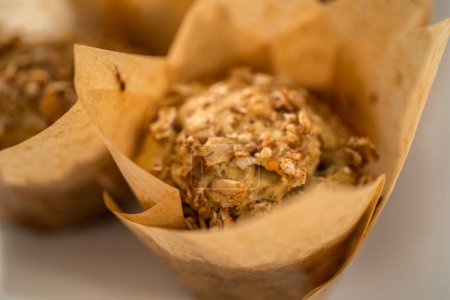 Photo for Freshly baked banana oatmeal muffins with oatmeal sugar topping. - Royalty Free Image