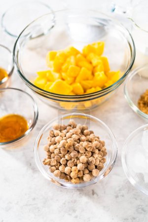 Photo for Flat lay. Measured ingredients in glass mixing bowls to prepare mango boba smoothie. - Royalty Free Image