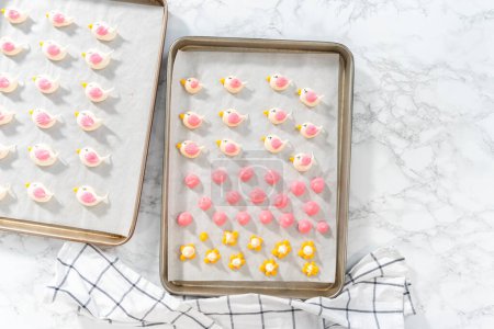 Photo for Freshly baked Easter meringue cookies in the shape of birds. - Royalty Free Image
