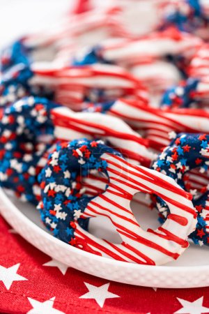 Photo for American flag. Red, white, and blue chocolate-covered pretzel twists. - Royalty Free Image