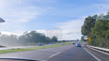 Photo for Los Angeles, California, USA-December 4, 2022-POV-Driving on HWY 101 near Santa Barbara, California, the road is shrouded in cloudiness during winter, creating a moody atmosphere while still - Royalty Free Image