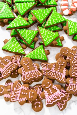 Photo for Many Christmas gingerbread cookies with royal icing. - Royalty Free Image
