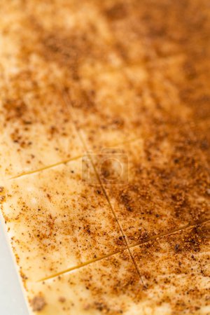 Photo for Scoring eggnog fudge with a wheel dough cutter for cutting into small pieces. - Royalty Free Image