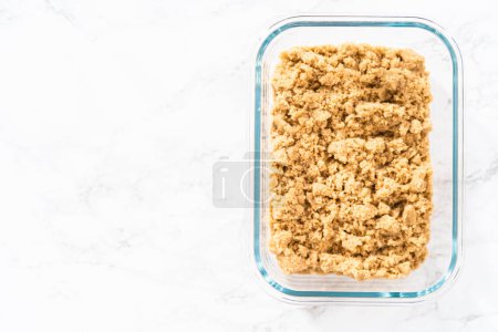 Photo for Light brown sugar on a marble counter top. - Royalty Free Image