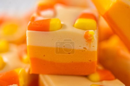 Photo for Homemade candy corn fudge square pieces on a white plate. - Royalty Free Image