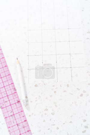 Photo for Preparing cutting template from parchment paper to cut homemade fudge. - Royalty Free Image