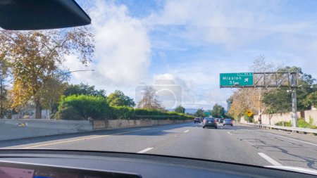 Photo for Los Angeles, California, USA-December 4, 2022-POV-Driving on HWY 101 near Santa Barbara, California, the road is shrouded in cloudiness during winter, creating a moody atmosphere while still - Royalty Free Image