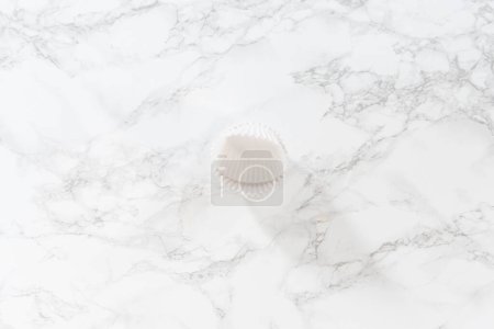 Photo for Flat lay. New white paper cupcake liners on the kitchen counter. - Royalty Free Image