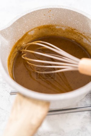 Photo for Cooking Swedish meatball sauce in a nonstick cooking pot. - Royalty Free Image