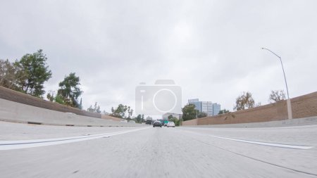 Photo for Los Angeles, California, USA-December 4, 2022-POV-Amidst a rainy winter day, driving on HWY 134 near Los Angeles, California, captures the atmosphere through raindrop-covered lenses, adding a unique - Royalty Free Image