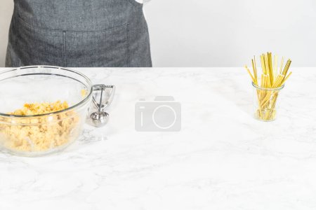 Photo for Scooping dough with dough scoop to make cactus cake pops for the Cinco de Mayo celebration. - Royalty Free Image