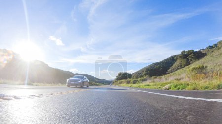 Photo for Los Angeles, California, USA-December 4, 2022-POV-Basking in the beauty of a sunny winter day, driving on HWY 1 near Las Cruces, California offers stunning views of the picturesque coastal landscape - Royalty Free Image