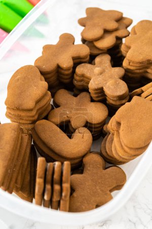 Photo for Undecorated stacks of gingerbread cookies are ready to be decorated with royal icing. - Royalty Free Image
