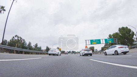 Photo for Los Angeles, California, USA-December 4, 2022-POV-On a rainy winter day, driving on HWY 134 near Los Angeles, California offers a moody and atmospheric experience. - Royalty Free Image