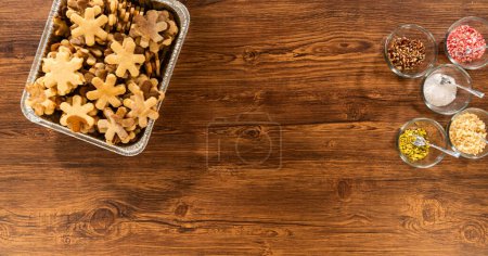 Photo for Golden-hued cookies shaped like snowflakes, intricately stacked. - Royalty Free Image