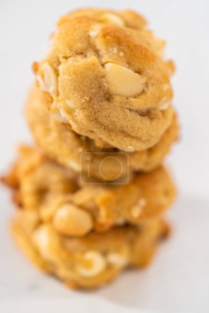 Photo for Stack of freshly baked white chocolate macadamia nuts on a kitc - Royalty Free Image