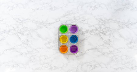Photo for Flat lay. New silicone cupcake liners of different colors on the kitchen counter. - Royalty Free Image