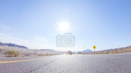 Photo for Embarking on a road trip from Nevada to California, driving on Highway 15 during the day offers scenic views and an exciting journey between states. - Royalty Free Image