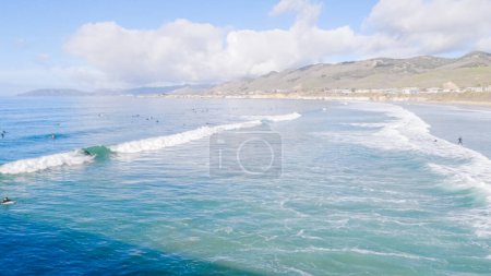 Photo for Pismo Beach is strikingly empty during a winter day, offering a serene and peaceful atmosphere with its expansive sandy shore and the soothing sounds of the waves. - Royalty Free Image