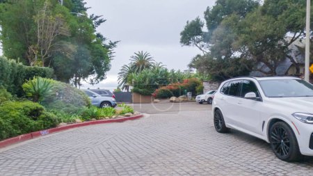 Photo for Los Angeles, California, USA-December 4, 2022-POV-Strolling the streets of Miramar Beach, California, the gloomy winter weather casts a serene atmosphere over the quaint coastal town. - Royalty Free Image