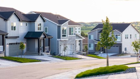 Photo for Nestled in a planned suburban development in Colorado, new construction houses stand proudly, showcasing modern architecture and promising a vibrant community for residents. - Royalty Free Image