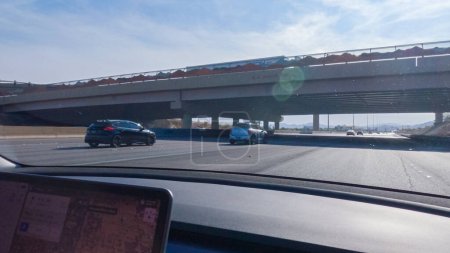 Photo for Las Vegas, Nevada, USA-December 3, 2022-Cruising through Las Vegas in a sleek Tesla vehicle on Highway 15 during the day adds an extra touch of luxury and sustainability to your road trip adventure to - Royalty Free Image