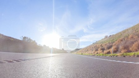 Photo for Basking in the beauty of a sunny winter day, driving on HWY 1 near Las Cruces, California offers stunning views of the picturesque coastal landscape against a backdrop of clear blue skies. - Royalty Free Image
