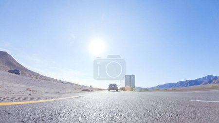 Photo for HWY 15, California, USA-December 3, 2022-Embarking on a road trip from Nevada to California, driving on Highway 15 during the day offers scenic views and an exciting journey between states. - Royalty Free Image