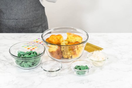 Photo for Measured ingredients in glass mixing bowls to make cactus cake pops for the Cinco de Mayo celebration. - Royalty Free Image