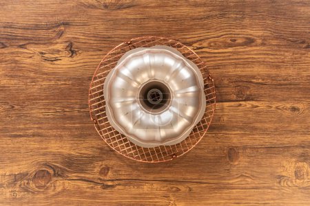 Photo for Flat lay. The gingerbread bundt cake cools gracefully on a wire rack, awaiting its sweet caramel frosting. - Royalty Free Image
