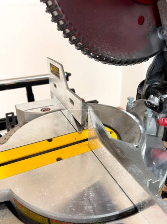 Photo for Get up close with the advanced features of a double bevel sliding miter saw, perfect for accurate and clean cuts in woodworking projects. - Royalty Free Image