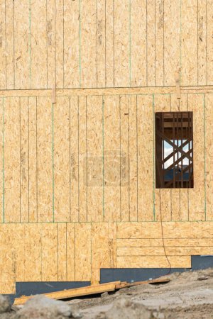 Photo for An ongoing construction site in the suburbs, featuring the framing stage of a single-family house. - Royalty Free Image