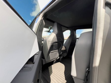 Photo for Denver, Colorado, USA-March 28, 2024-The interior shot of the Tesla Cybertruck showcases the roomy rear cabin with its modern, streamlined seats and durable flooring, reflecting the blend of utility - Royalty Free Image