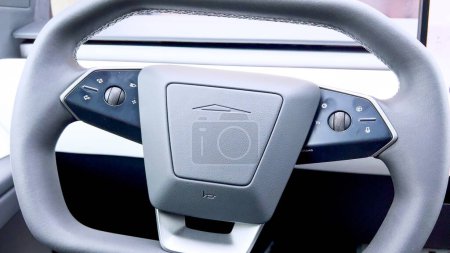 Photo for Denver, Colorado, USA-April 28, 2024- This image captures the unique and modern steering wheel of the Tesla Cybertruck, showcasing its sleek design and minimalistic control features, emphasizing the - Royalty Free Image