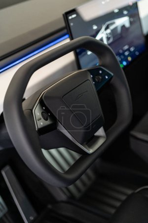 Photo for Denver, Colorado, USA-May 5, 2024-This image captures the futuristic interior of the Tesla Cybertruck, focusing on the steering wheel and its integrated control panels, highlighting the vehicle - Royalty Free Image