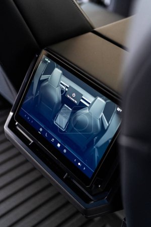 Photo for Denver, Colorado, USA-May 5, 2024-This image captures the sophisticated rear seat screen interface in the Tesla Cybertruck, highlighting the vehicle cutting-edge technology and user-friendly features - Royalty Free Image