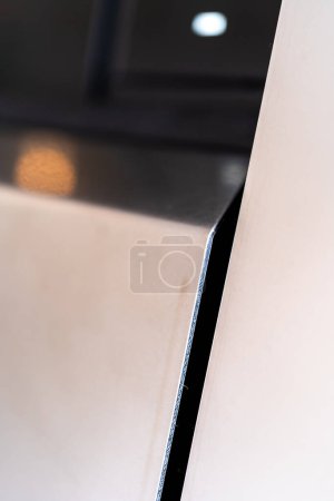 Photo for Denver, Colorado, USA-May 5, 2024-A close-up image capturing the precise panel seam of the Tesla Cybertruck, highlighting the minimalist design and sharp contours that characterize the exterior of - Royalty Free Image