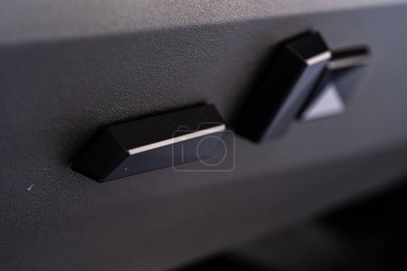 Photo for Denver, Colorado, USA-May 5, 2024-This image captures a close-up view of the seat adjustment buttons located in the Tesla Cybertruck, emphasizing the minimalist and sleek design of the vehicle - Royalty Free Image