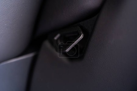 Photo for Denver, Colorado, USA-May 5, 2024-This image shows a detailed view of the back seat release pull strap in a Tesla Cybertruck, emphasizing the subtle yet functional design integrated within the vehicle - Royalty Free Image