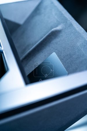 Photo for Denver, Colorado, USA-May 5, 2024-his image captures the sleek Tesla Cybertruck key card positioned neatly in the vehicle card holder, highlighting its minimalist design and emphasizing the modern - Royalty Free Image