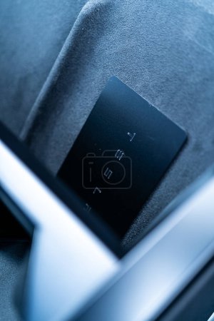 Photo for Denver, Colorado, USA-May 5, 2024-his image captures the sleek Tesla Cybertruck key card positioned neatly in the vehicle card holder, highlighting its minimalist design and emphasizing the modern - Royalty Free Image