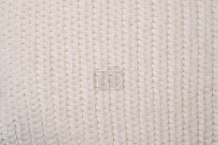 Photo for Detailed view of a white knitted fabric material, showcasing intricate loops and patterns up close. - Royalty Free Image