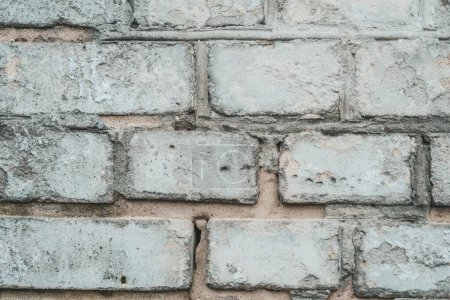 An up-close view showcasing the intricate details of a brick wall constructed with individual bricks.