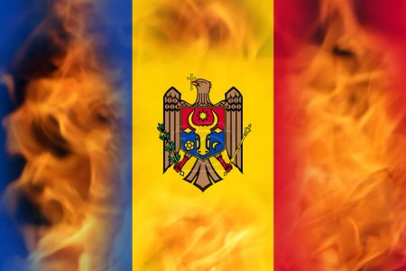 Photo for Defocus protest in Moldova. Moldova flag painted on fire flame background. Strength, Power, Protest concept. Russia war. World crisis. Out of focus. - Royalty Free Image